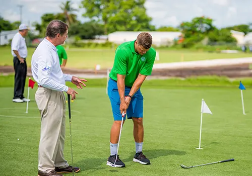 Golf teaching and learning MS student practicing coaching techniques on a golf course