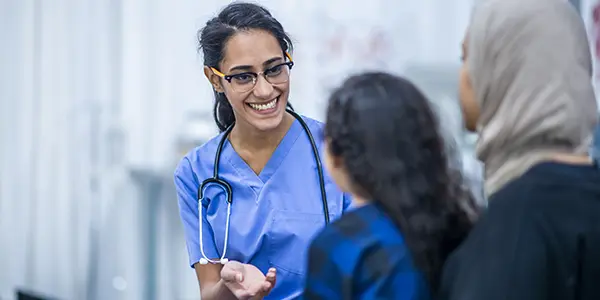 Family nurse practitioner MSN student assessing patient health during a consultation